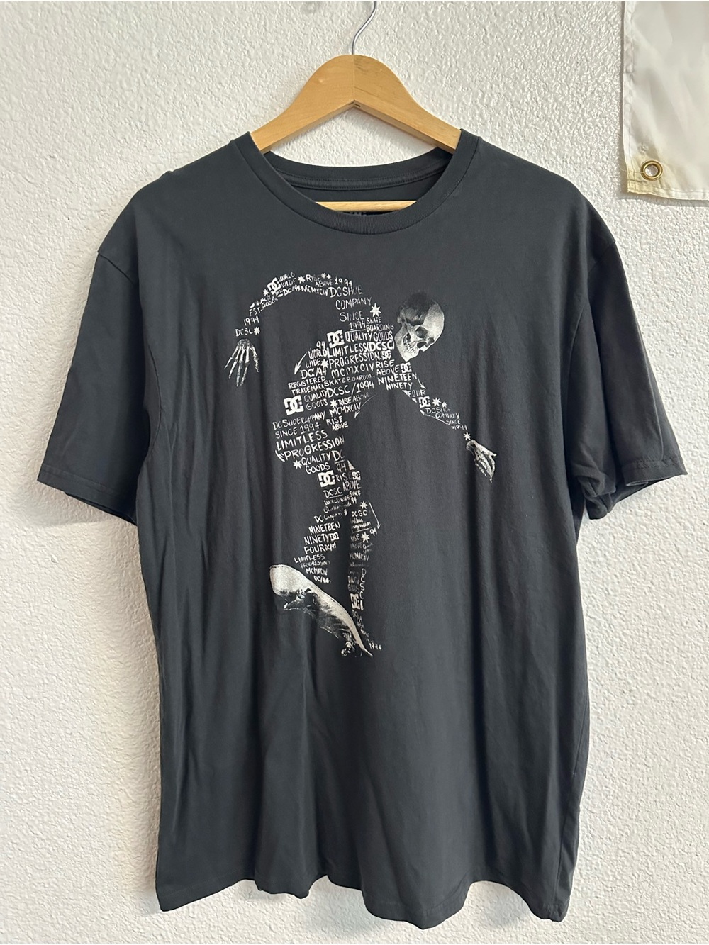 DC Black Short Sleeve Tee with White Skeleton Skate Graphic